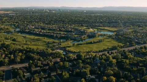 4k drone - Golf course in Denver at sunset, Rocky Mountains on the horizon. Stock Footage 95097906