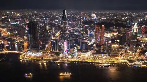 4k drone hyperlapse of  ho chi minh city during the night skyscrappers skyine Stock Footage 204005860