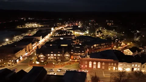 4k drone moving left above small town of Westport CT at night Stock Footage 290997426