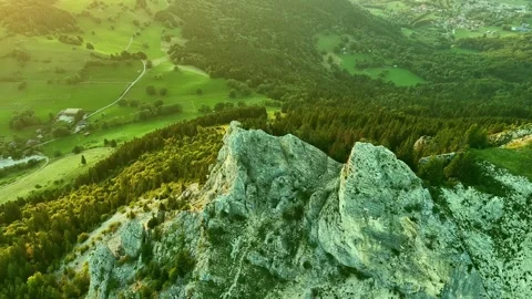 4K drone orbit around alpine rocky ridge and forest Stock Footage 331098923