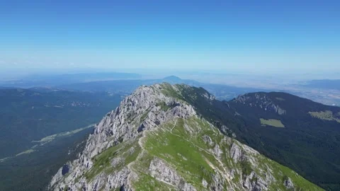 4K drone orbit around mountain peak – cinematic aerial rotation Stock Footage 343818445