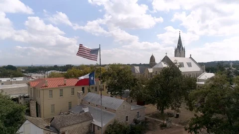 4K Drone Orbit Texas Flag with Church Slow Motion Stock Footage 118398380