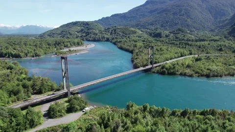 4K Drone orbitating and revealing a beautiful bridge over the Yelcho river. Stock Footage 249010159