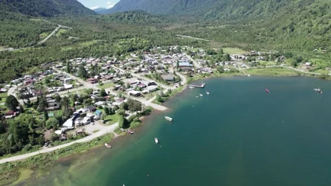 4K Drone orbitating over the town of Puyuhuapi on the Chilean Austral Highway Stock Footage 249010619