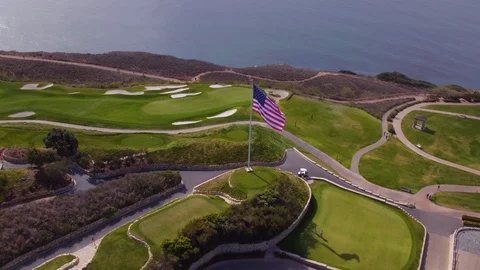 4K drone Orbiting shot of large American flag at Trump National LA Stock Footage 89644067