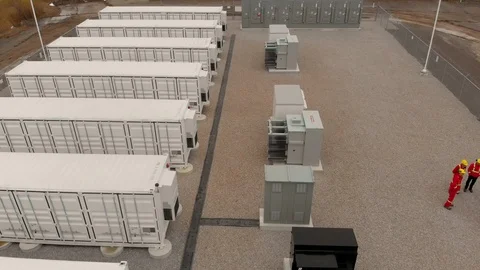 4K drone over battery storage and energy engineers Stock Footage 129785099