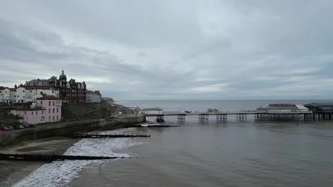 4K Drone Over the Ocean Facing Cromer Pier Stock Footage 297016217