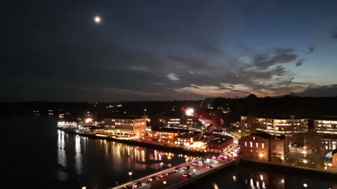4k drone over a river splitting a small Connecticut city at night Stock Footage 290990057