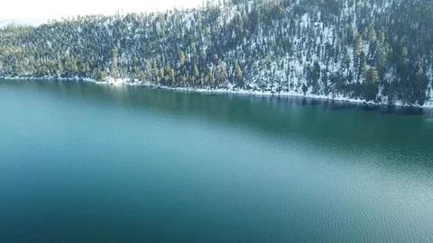 4K drone panning over Emerald Bay Snow shoreline lake tahoe Stock Footage 143882505