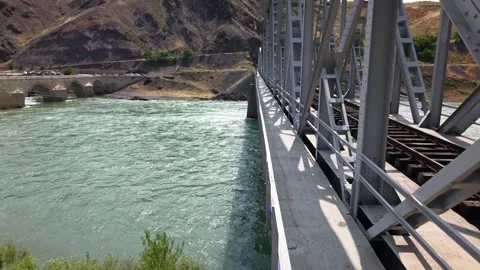4K Drone Parallel Flight Along Railway Bridge Over River Stock Footage 336240991