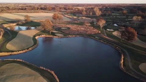 4k Drone Pass by Golf Course with Pond Stock Footage 236524656