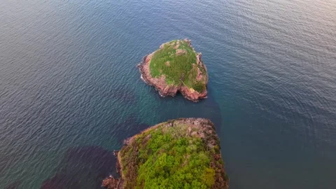 4K Drone Perspective Moving from Land Towards a Scenic Island Stock Footage 334325932