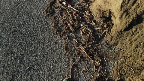 4K Drone plastic litter washed up on beach strandline, Wales 스톡 동영상 186474364