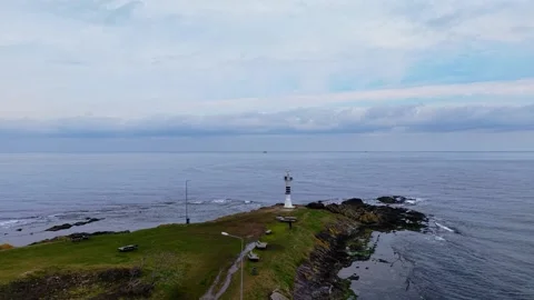 4K Drone Push-in: Yason Burnu Lighthouse and Blue Sea, Overcast Winter Sky Stock Footage 334338420