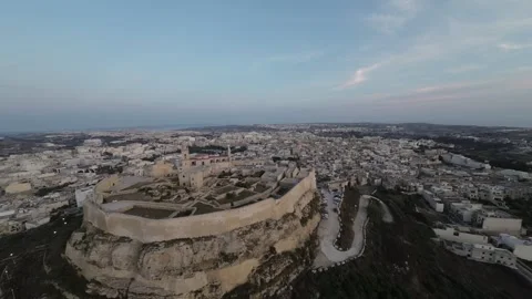 4K Drone RAW Ancient Medieval Fortress at Sunset on Gozo island. Gozo Citadel Stock Footage 248729331