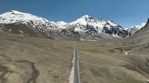 4K Drone Rising Over Snowy Himalayan Road | Manali Leh Highway Winter Landscape Stock Footage 312495493