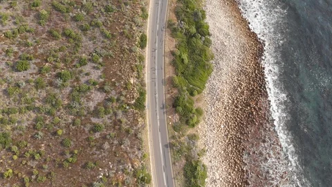 4k Drone. Road next to rocky coast line Stock Footage 93046292