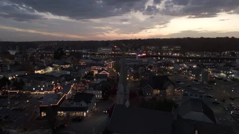 4k drone rotating left around church spire with city and bold sky in background Stock Footage 291103649