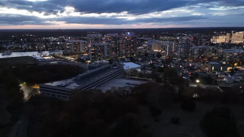 4k drone rotating left to right, high rise buildings in the distance at night Stock Footage 291280912