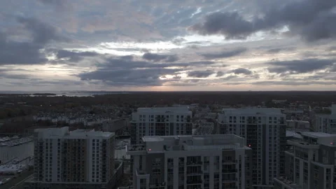 4k drone rotating right to left, high rise buildings at dusk with bold sky Stock Footage 291240602