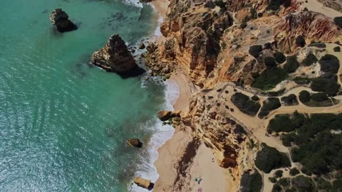 4K Drone - Rugged cliffs, sandy coast ocean Ponta Da Piedade. Algarve. Portuga Stock Footage 239270285