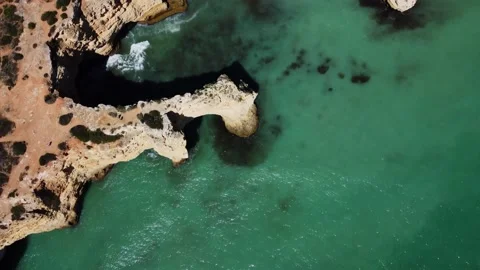 4K Drone - Rugged cliffs, sandy coast ocean Ponta Da Piedade. Algarve. Portugal Stock Footage 239270319