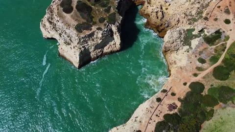 4K Drone. Rugged cliffs, sandy coast ocean Ponta Da Piedade. Algarve. Portugal. Stock Footage 239778864