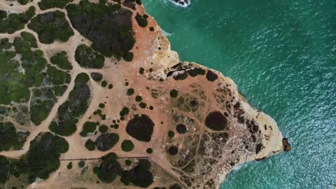 4K Drone. Rugged rocky cliffs, beach, sandy coast ocean waves. Algarve. Portugal Stock Footage 240127873
