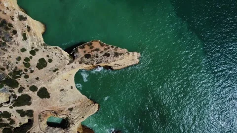 4K Drone. Rugged rocky cliffs, beach, sandy coast ocean waves Algarve. Portugal Stock Footage 240127919