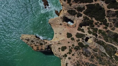 4K Drone. Rugged rocky cliffs, beach, sandy coast ocean waves. Algarve. Portugal Stock Footage 240127938