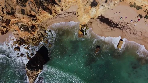 4K Drone. Rugged rocky cliffs, beach, sandy coast ocean waves. Algarve. Portugal Stock Footage 240127962