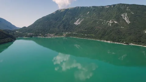 4k drone shot of a beautiful emerald lake in Italy Stock Footage 204094127