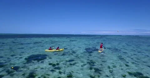 4K Drone Shot Of Boy Doing Standing Cayacing In Mauritius Waters. Vidéo 66762612