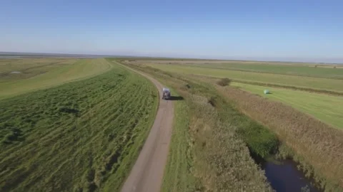 4K Drone shot of Camper in front of green gras fields Vídeo Stock 249018933