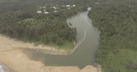 4k Drone shot of an estuary, river meets the ocean near jungle 스톡 동영상 88023161