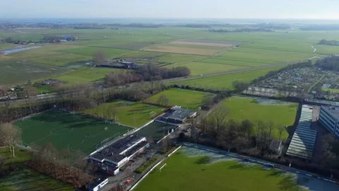4k Drone shot of flat green fields lawn medow with motorway highway in Nethe Stock Footage 147879281