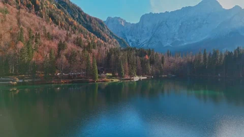 4K Drone Shot – Flying Forward Over Lago di Fusine in Autumn With Mountain View Vidéo 306095336