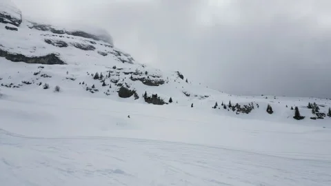 4K Drone Shot Flying Forward Up Snowy Mountain in French Alps, Near Flaine 動画素材 326351050