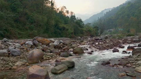 4K drone shot flying just above a fast-flowing Himalayan river in Sikkim, India. Stock Footage 341975116