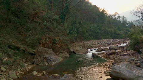 4K drone shot flying just above a fast-flowing Himalayan river in Sikkim, India. Stock Footage 341975441