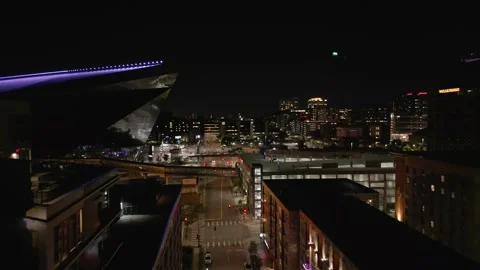 4K Drone Shot Flying Past Buildings Towards Stadium In Minneapolis At Night Stock Footage 225650254