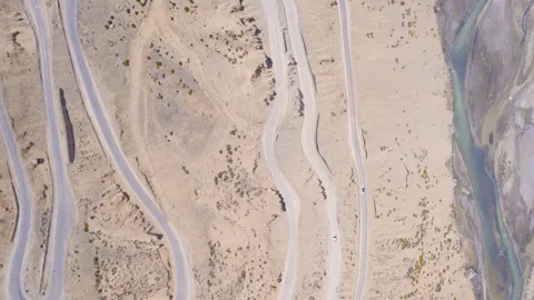 4K Drone Shot of Gata Loops, Ladakh – Hairpin Bends on Remote Himalayan Road Stock Footage 310484686