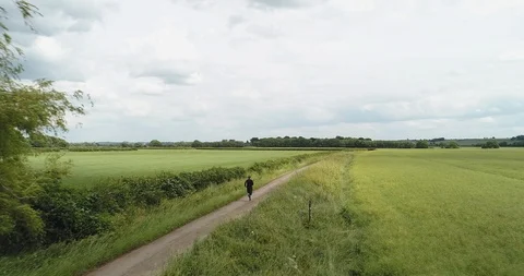 4K Drone Shot Of Man Running In The British Country Side. Long Run Training. Stock Footage 91233251