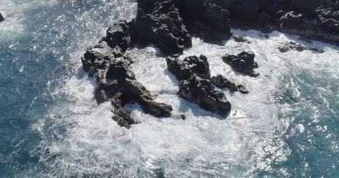 4k drone shot of oceanic beautiful waves crashing rocks Stock Footage 83873280