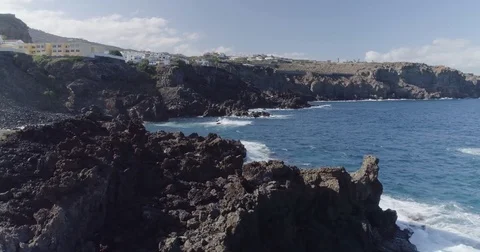 4k drone shot of oceanic beautiful waves crashing rocks Stock Footage 83873545