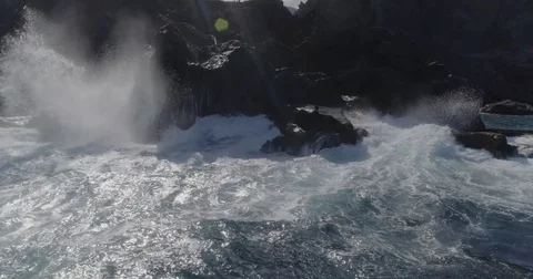 4k drone shot of oceanic dramatic powerful waves hitting rocks Stock Footage 83872434
