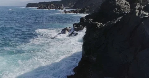 4k drone shot of oceanic powerful waves hitting rocks Stock Footage 83871313