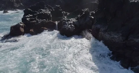 4k drone shot of oceanic powerful waves hitting rocks Stock Footage 83871340