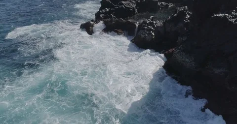 4k drone shot of oceanic powerful waves hitting rocks Stock Footage 83871369