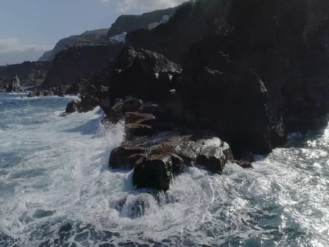 4k drone shot of oceanic powerful waves hitting rocks Stock Footage 83872300